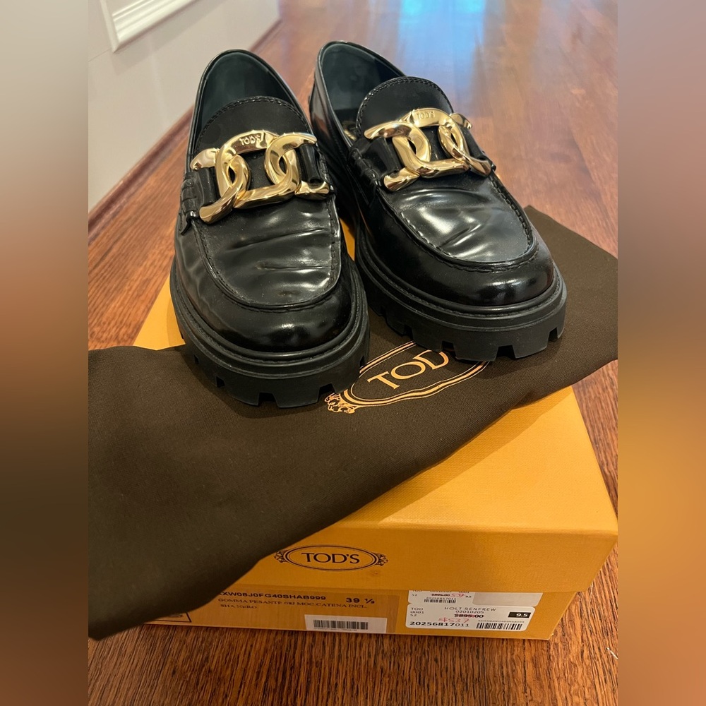 Tod's Black Leather Loafers with Gold Chain Accent